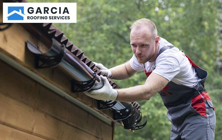 A professional roofer Installing roof drip edge